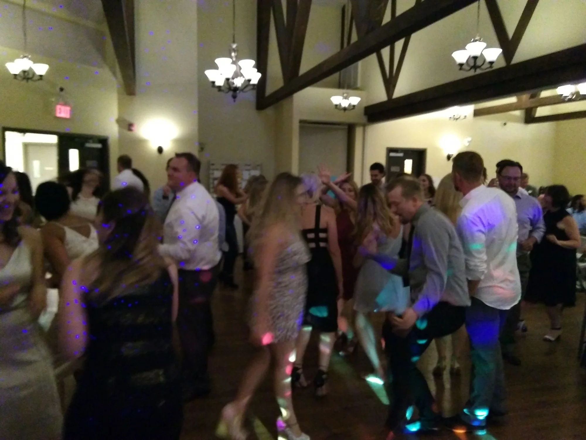 Wedding reception guests dancing under DJ Eddie Black lighting — Alberta wedding DJ